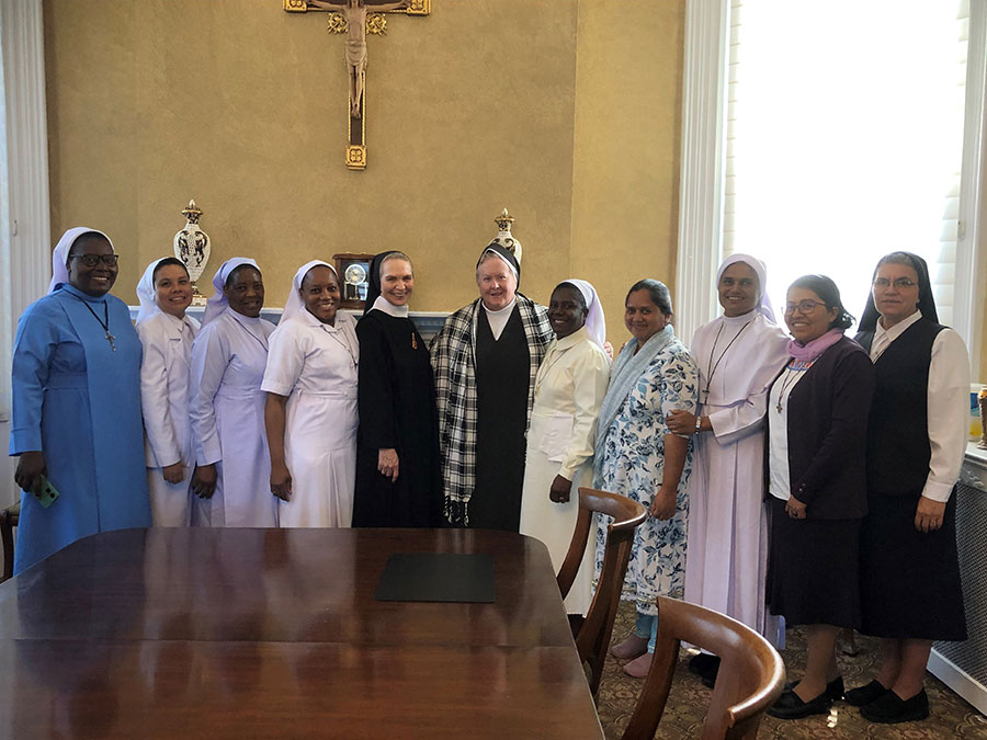 Our international Sisters presenting Mother Rose Heery with a gift shawl.